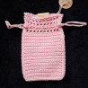 Pochette à bijoux en coton, avec fermeture par lanières coulissantes.