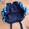 Le sac boule au crochet, avec une doublure en tissu pour une belle finition.